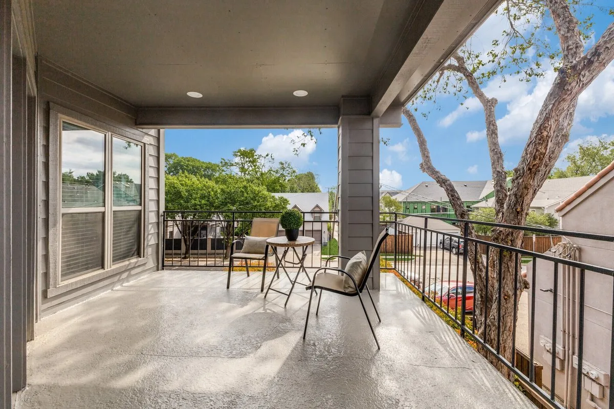 Private covered patio with a bistro set overlooking the neighborhood