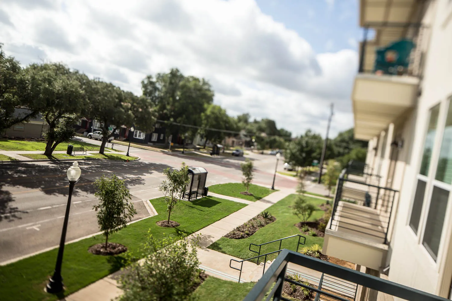 The view from a Regalia balcony across N Bishop Ave to a tree-lined park