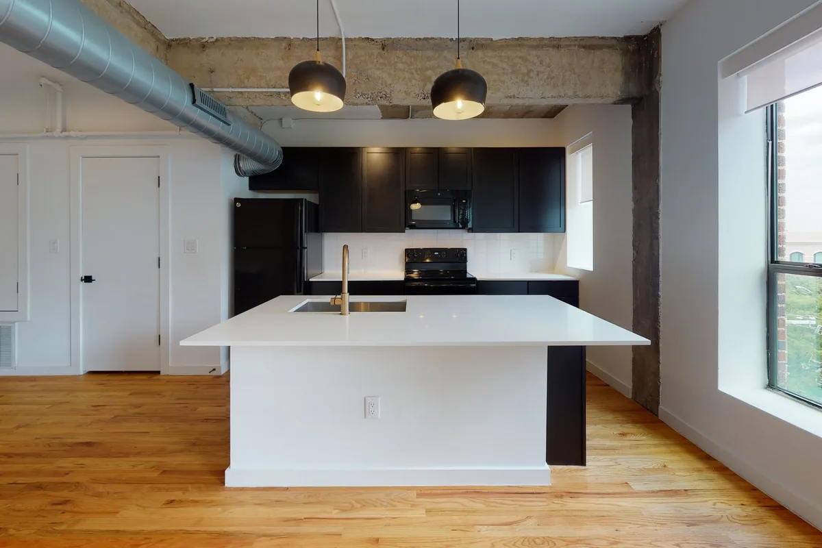 Kitchen and living area in The Chaplin one-bedroom, from its 3D tour