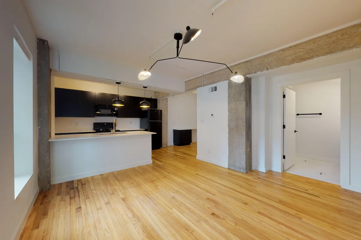 Open kitchen and living area in The Hughes one-bedroom, from its 3D tour