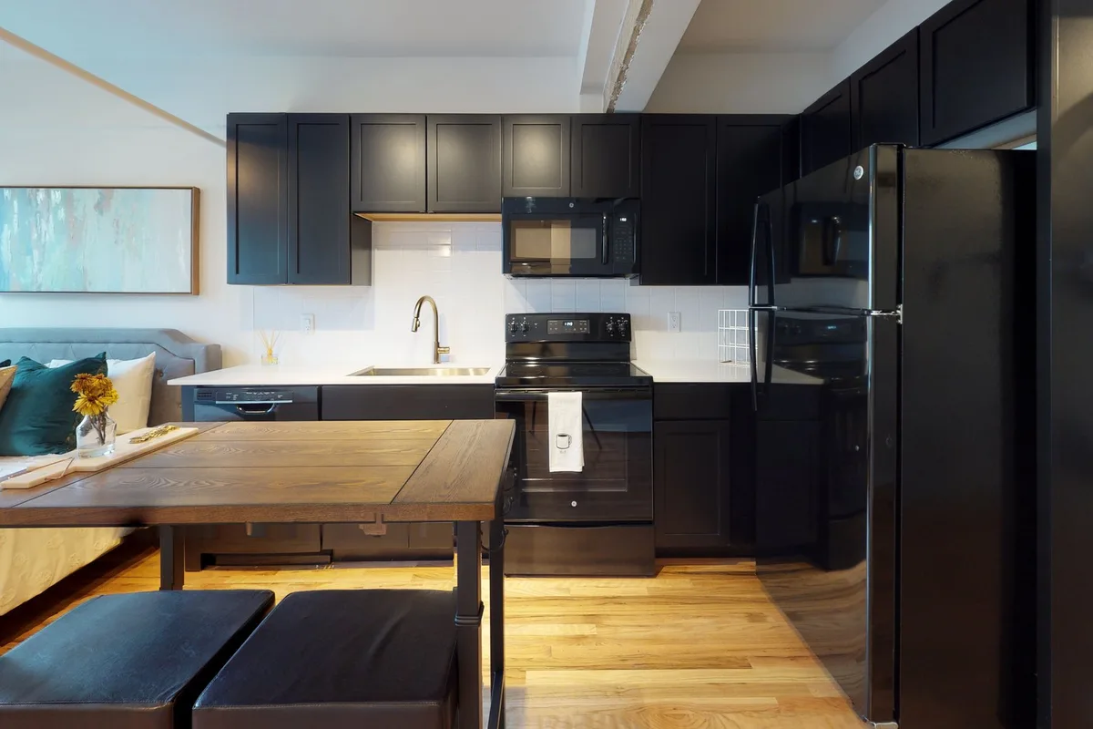 Open kitchen and living area in The Ellington studio, from its 3D tour