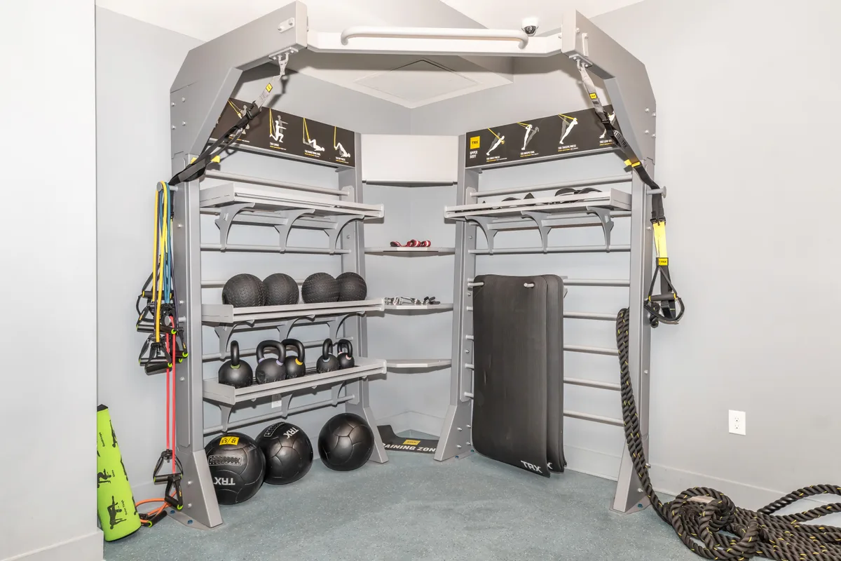 Functional-training corner with TRX straps, kettlebells, medicine balls and battle ropes