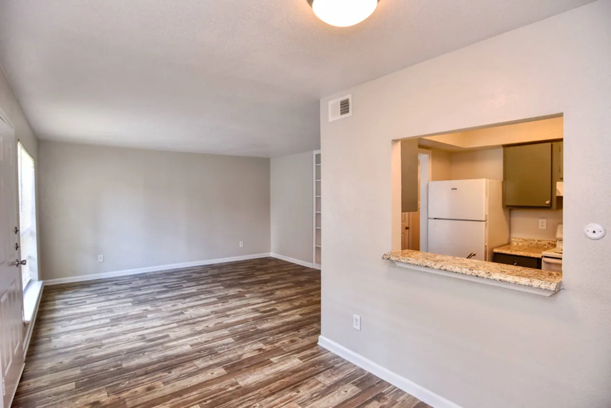 Living and dining area with a breakfast-bar pass-through to the galley kitchen