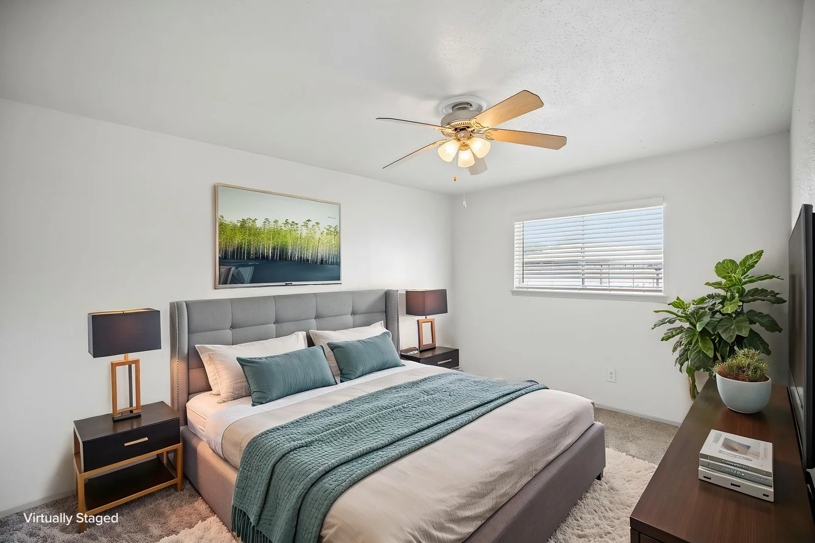 Virtually staged two-bedroom primary bedroom with an upholstered bed