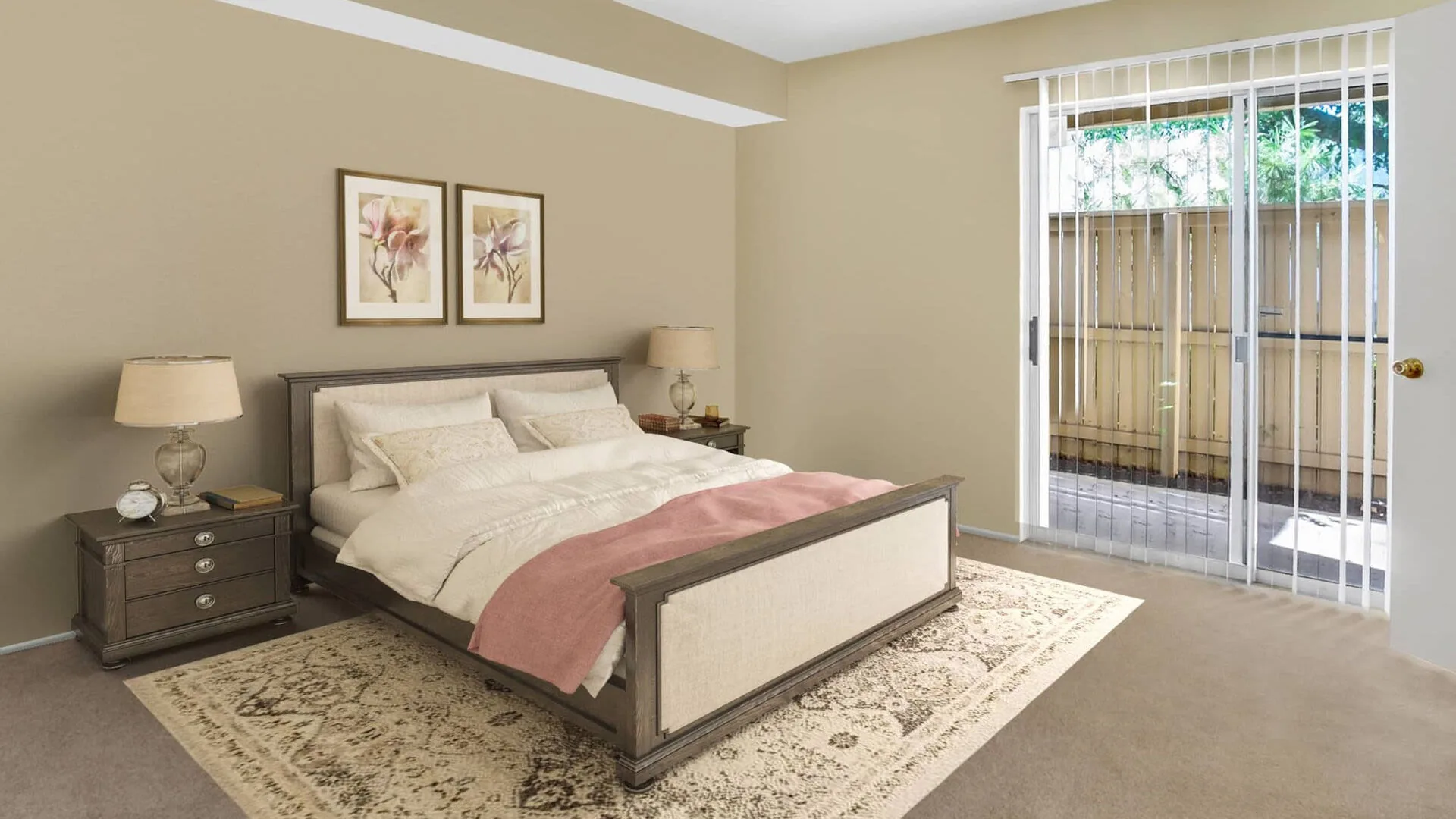 Bedroom with a queen bed, twin nightstands and a sliding door to a private patio