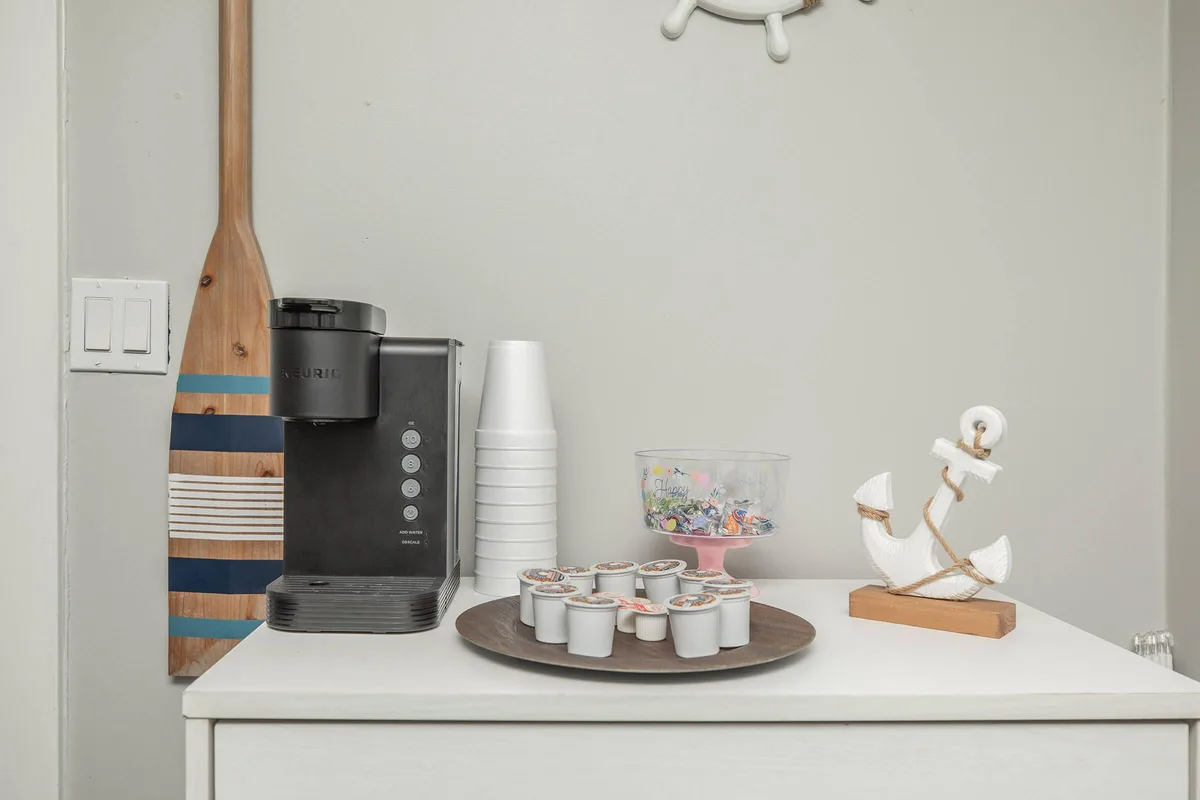 Resident coffee bar with a self-serve coffee maker in the leasing office