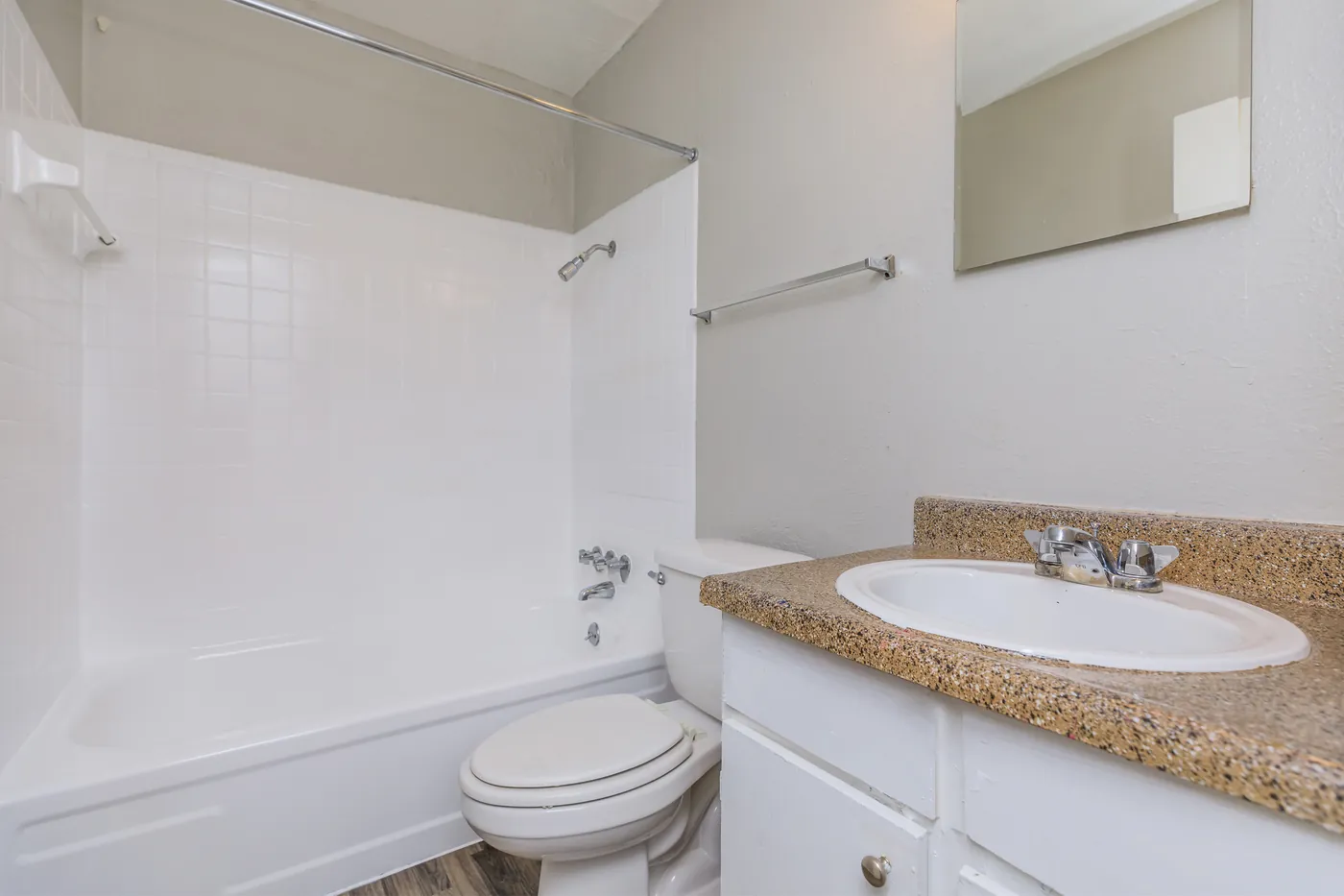 Full bathroom with tub-shower and granite-look vanity